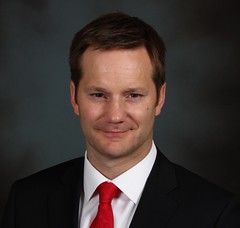 Travis Dowle, CFA is the President and Fund Manager of Lions Investment Management